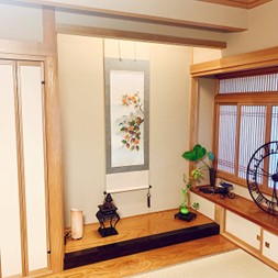 A traditional Japanese inn or restaurant with a hanging scroll